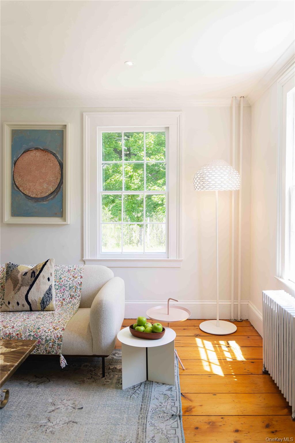 210 Middle Road Hudson, NY 12534 - Photo 15 of 42 Bright room featuring a multi-pane window, wood-finish flooring, a white baseboard radiator, recessed lighting, and crown molding