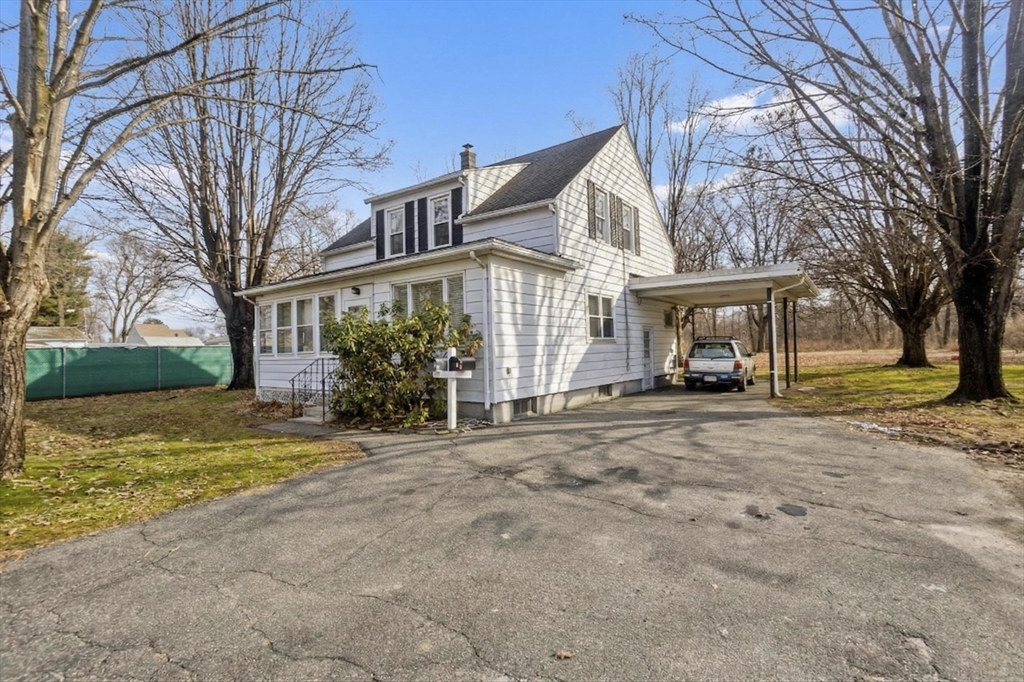 177 Marion Street Chicopee, MA 01013 - Photo 36 of 36 a view of a house with a large trees next to a road