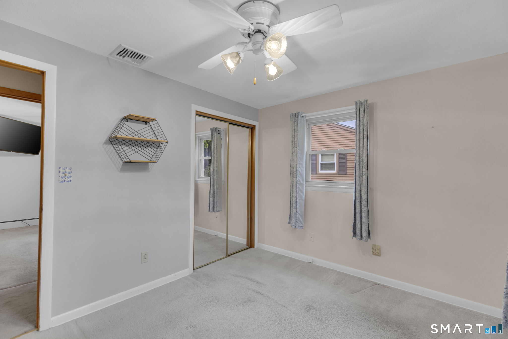 102 Wayne Lane Meriden, CT 06450 - Photo 20 of 36 an empty room with windows and ceiling fan