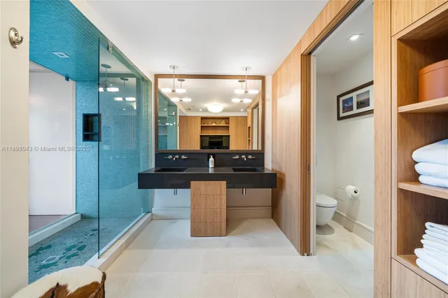 a spacious bathroom with a granite countertop sink and a mirror