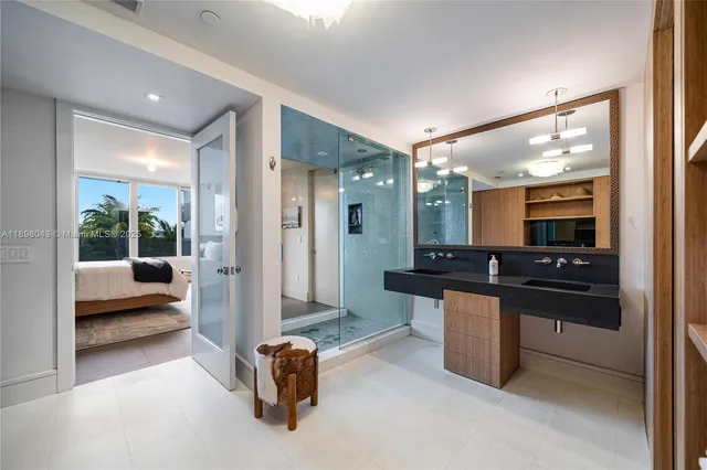 a kitchen with stainless steel appliances granite countertop a sink and a refrigerator