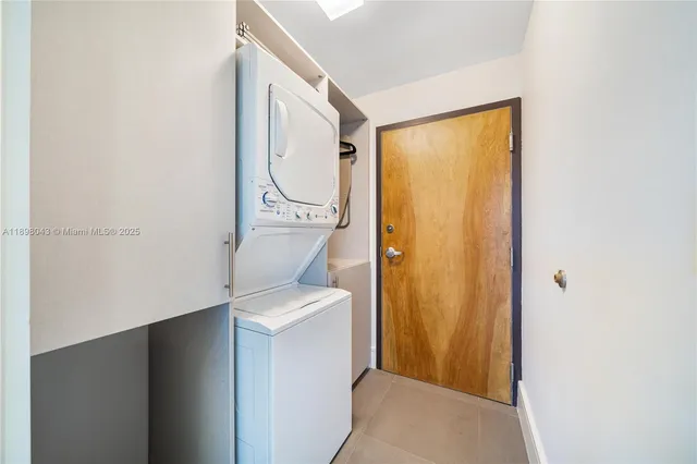 a utility room with a window washer and dryer