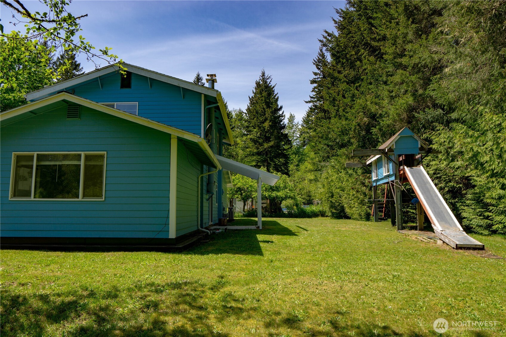 89 Slab Camp Road Sequim, WA 98382 - Photo 30 of 40 a backyard of a house with lots of green space
