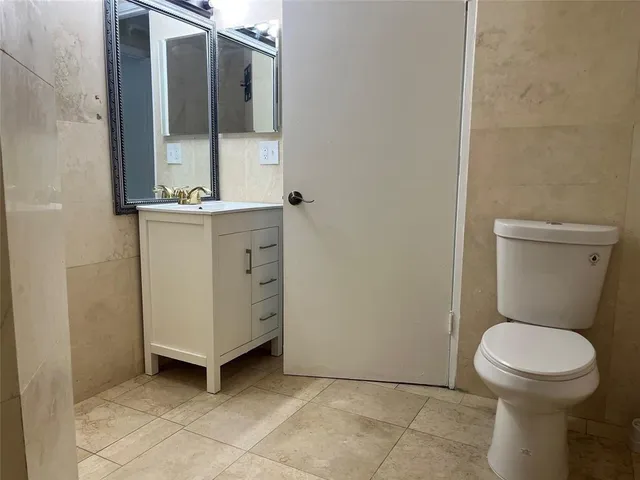 a bathroom with a toilet and a sink