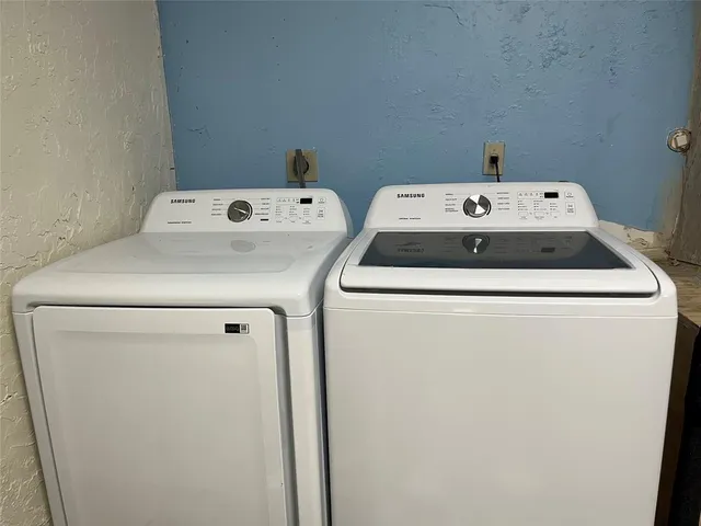 a utility room with dryer and washer