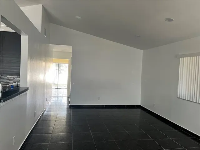 a view of an empty room and window