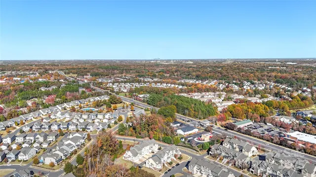 an aerial view of residential building and green space
