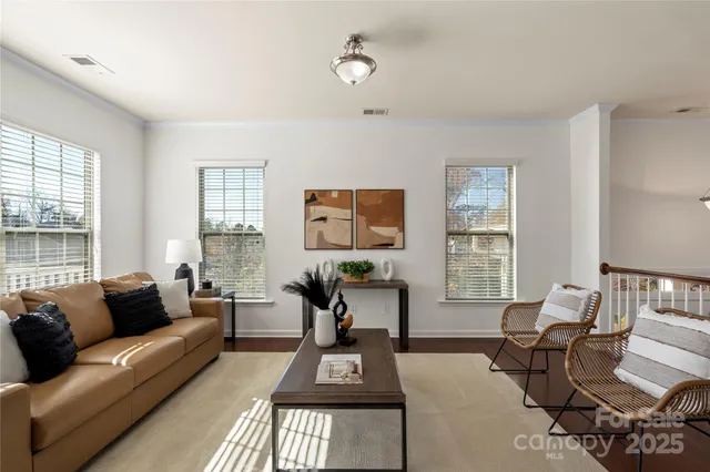 a living room with furniture and windows