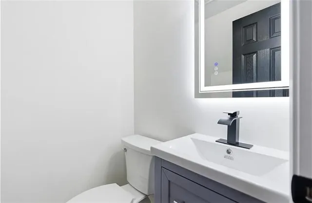 a bathroom with a sink and mirror