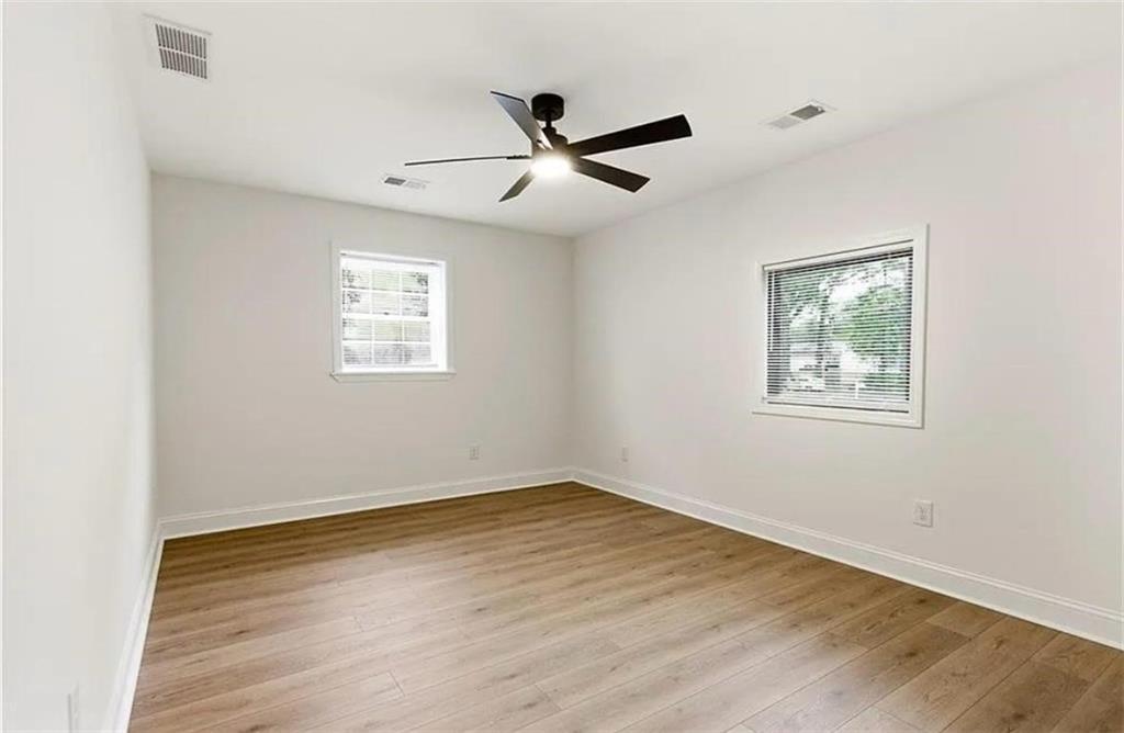 10 Hawk Road Northwest Cartersville, GA 30121 - Photo 18 of 23 a view of empty room with wooden floor and fan