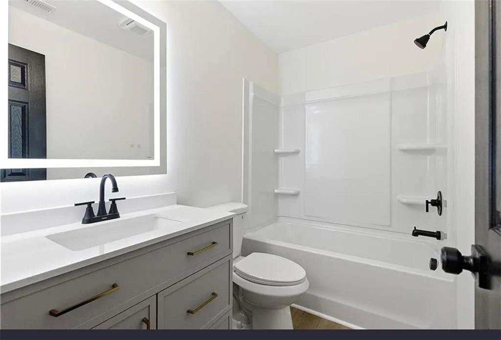10 Hawk Road Northwest Cartersville, GA 30121 - Photo 19 of 23 a bathroom with a sink a toilet and shower