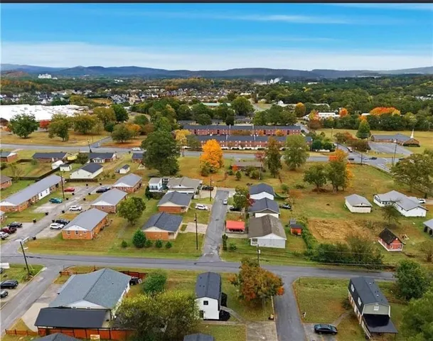 an aerial view of residential building and car parked