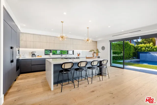 a living room with furniture flat screen tv and a fireplace