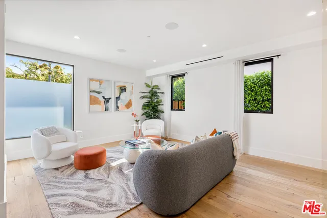 a swimming pool view with a outdoor seating space