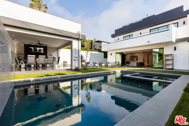 a view of a backyard with sitting area
