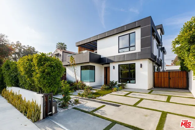 a view of front door and potted plants