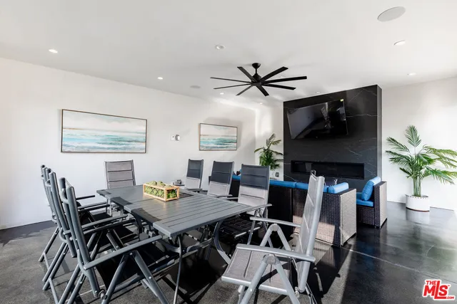 a view of swimming pool with outdoor seating