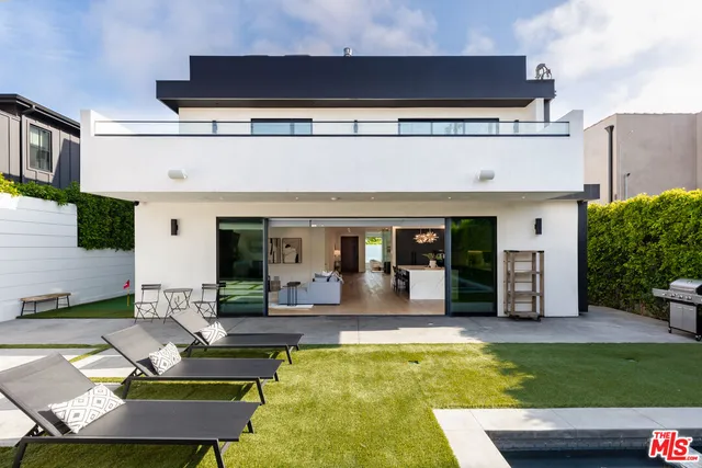 a view of swimming pool with chairs