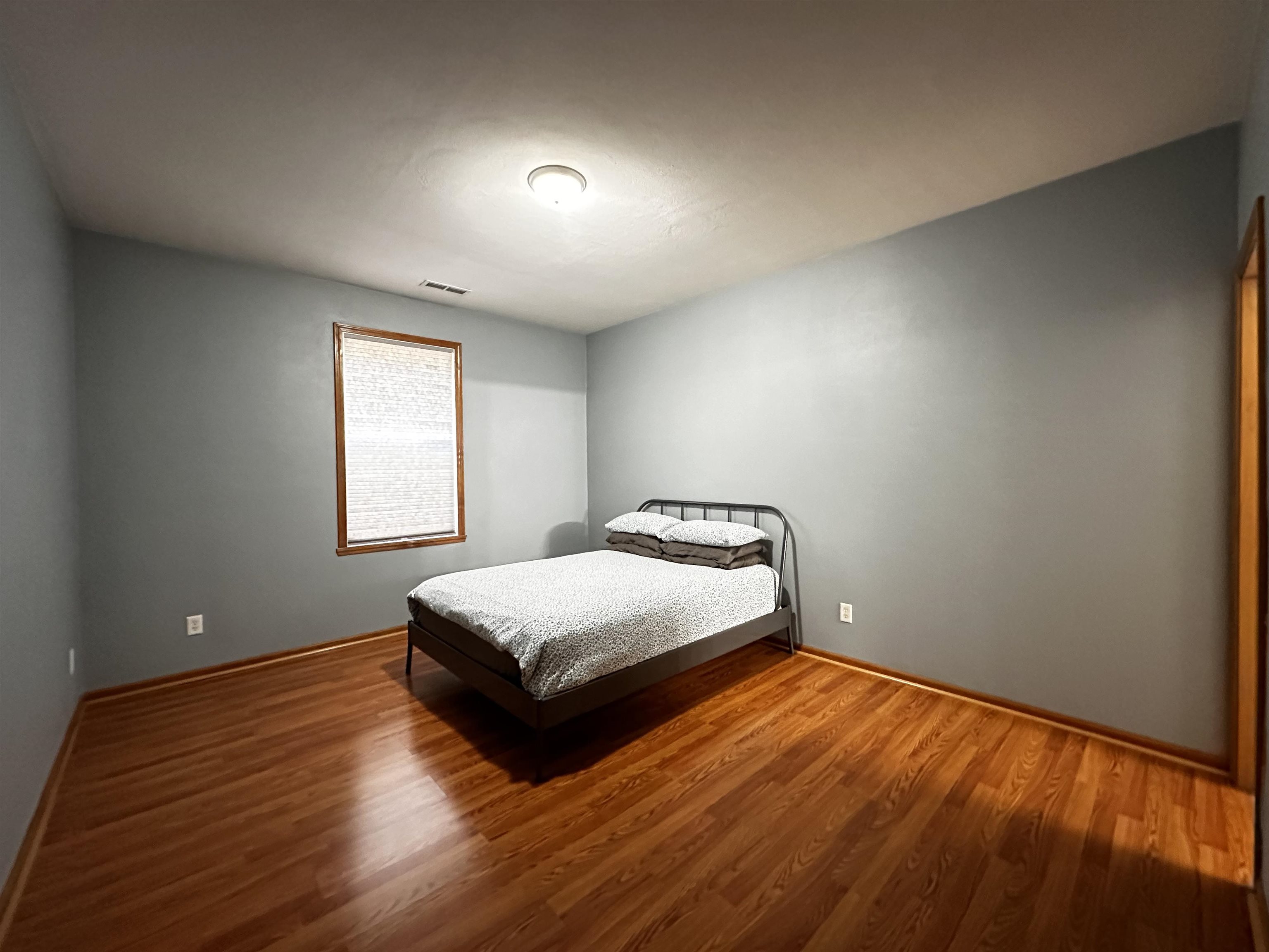 10135 Monarch Road, Unit 2 Roscoe, IL 61073 - Photo 8 of 13 a bedroom with a bed and window