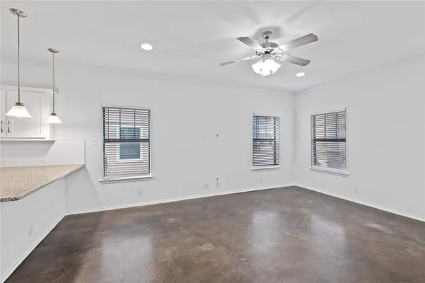 a living room with furniture potted plant and a window