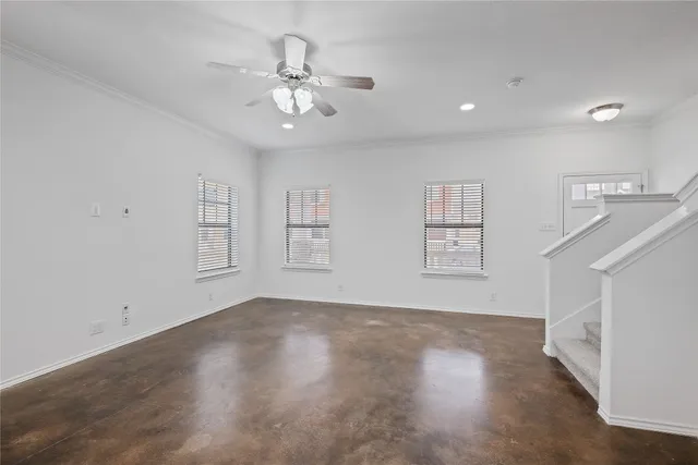 a living room with furniture kitchen area and a view of kitchen