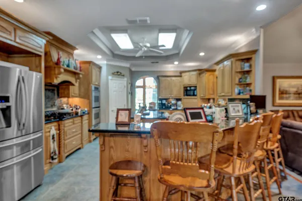 a kitchen with stainless steel appliances granite countertop lots of counter top space