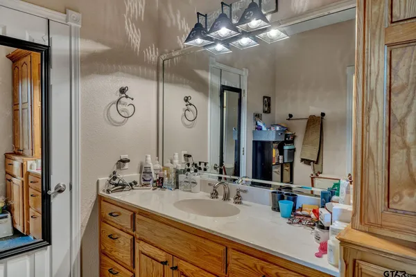 a bathroom with a tub a sink and a shower