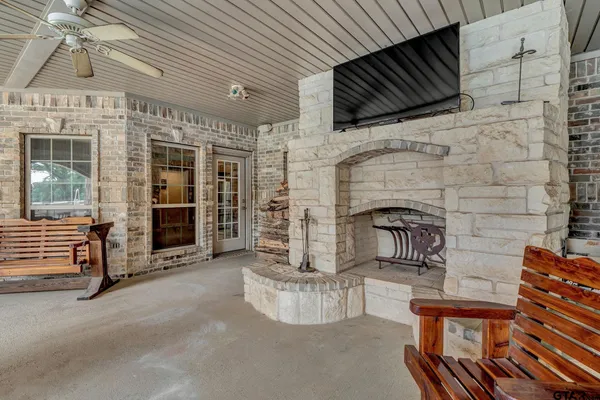 a living room with fireplace furniture and a flat screen tv