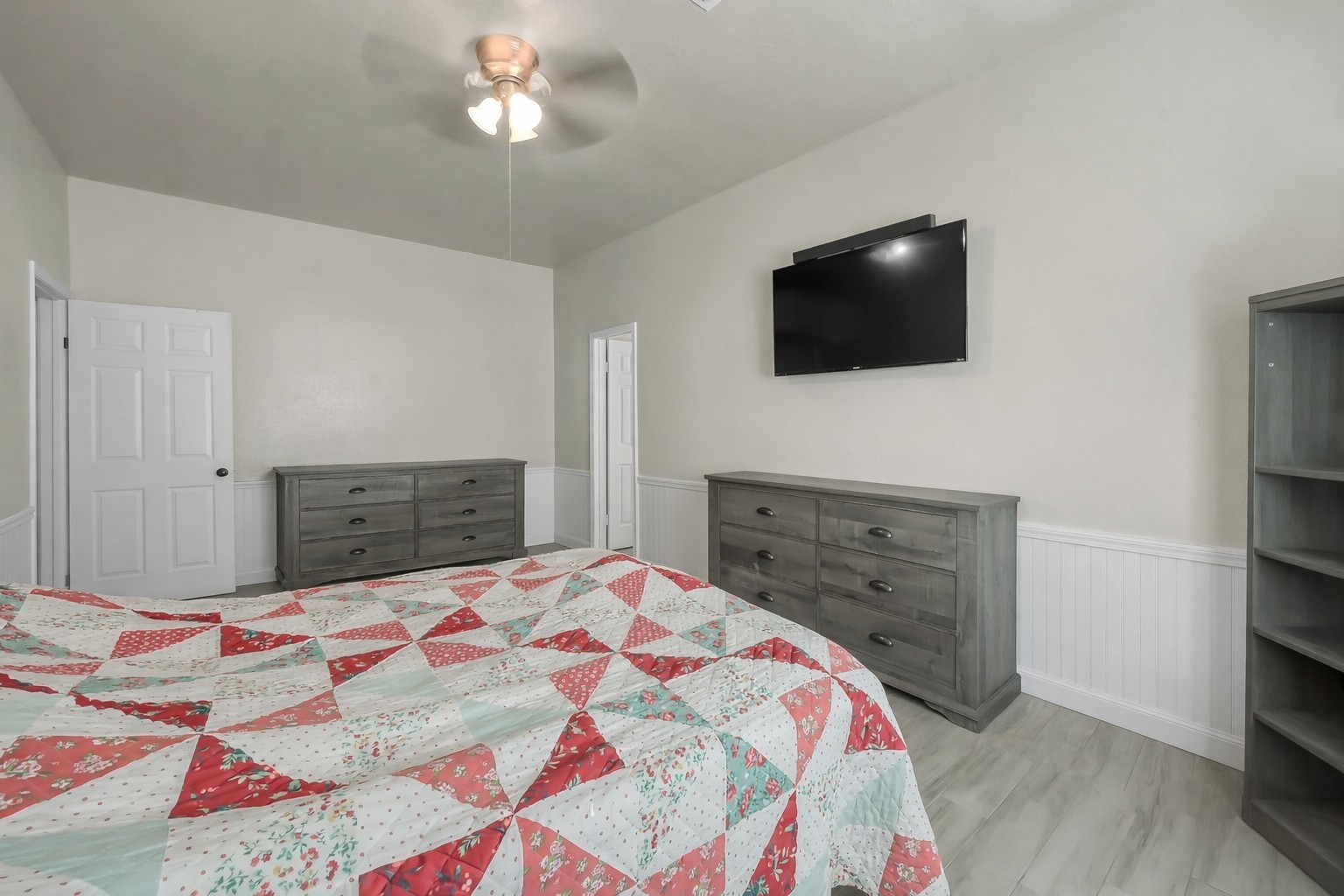 29206 Stapleford Street Spring, TX 77386 - Photo 16 of 22 a bedroom with a bed and a flat screen tv
