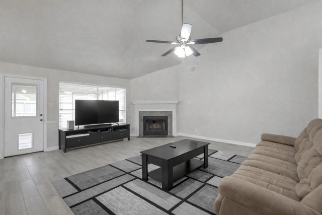 29206 Stapleford Street Spring, TX 77386 - Photo 5 of 22 a living room with furniture and a flat screen tv