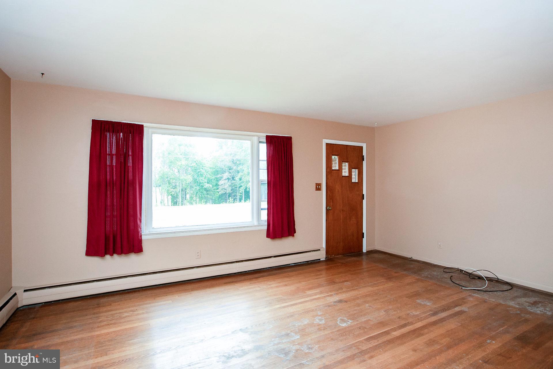 2815 Holland Cliffs Road Huntingtown, MD 20639 - Photo 11 of 21 View to front door and expansive window.