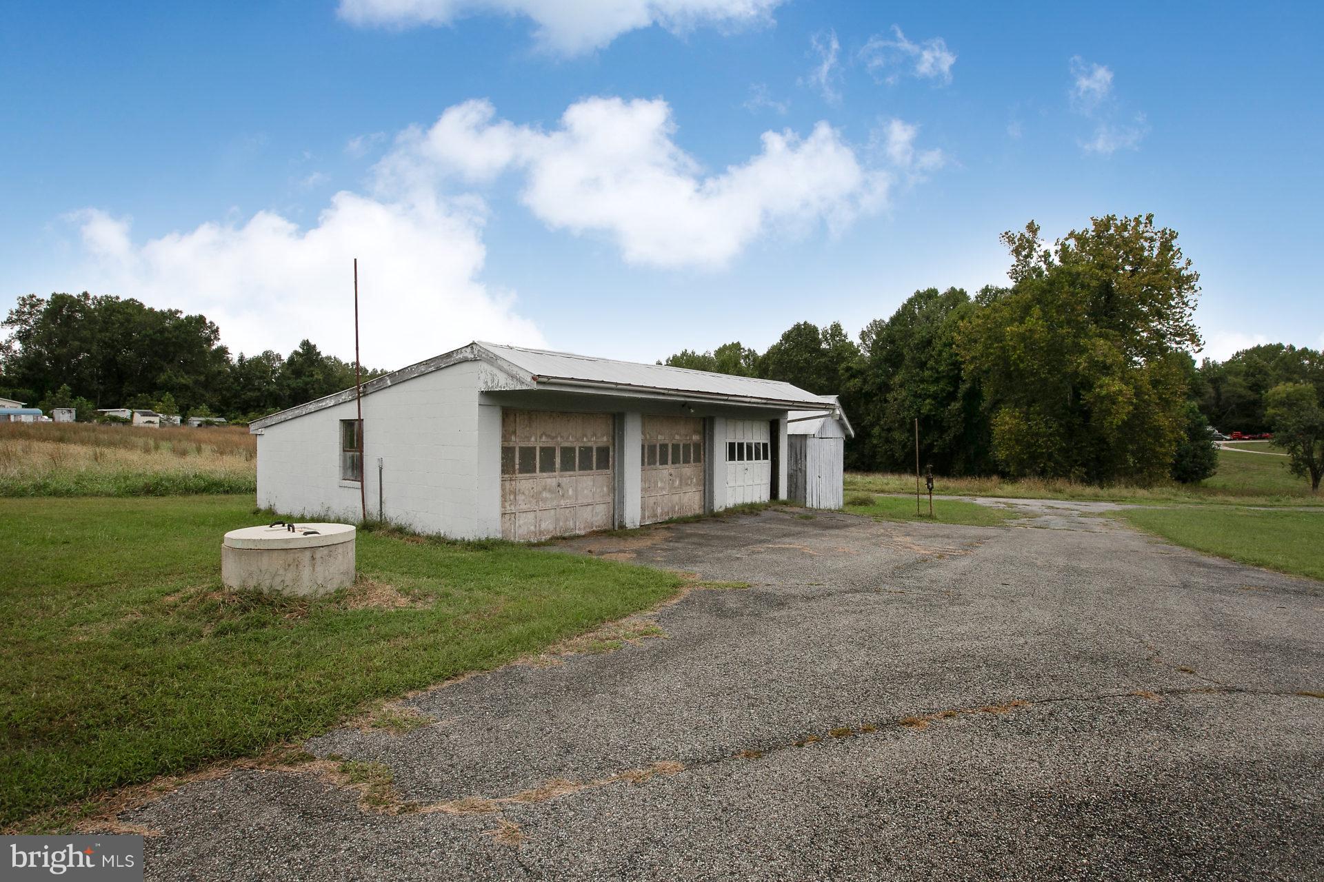 2815 Holland Cliffs Road Huntingtown, MD 20639 - Photo 4 of 21 Well cap, garage and tool shed.