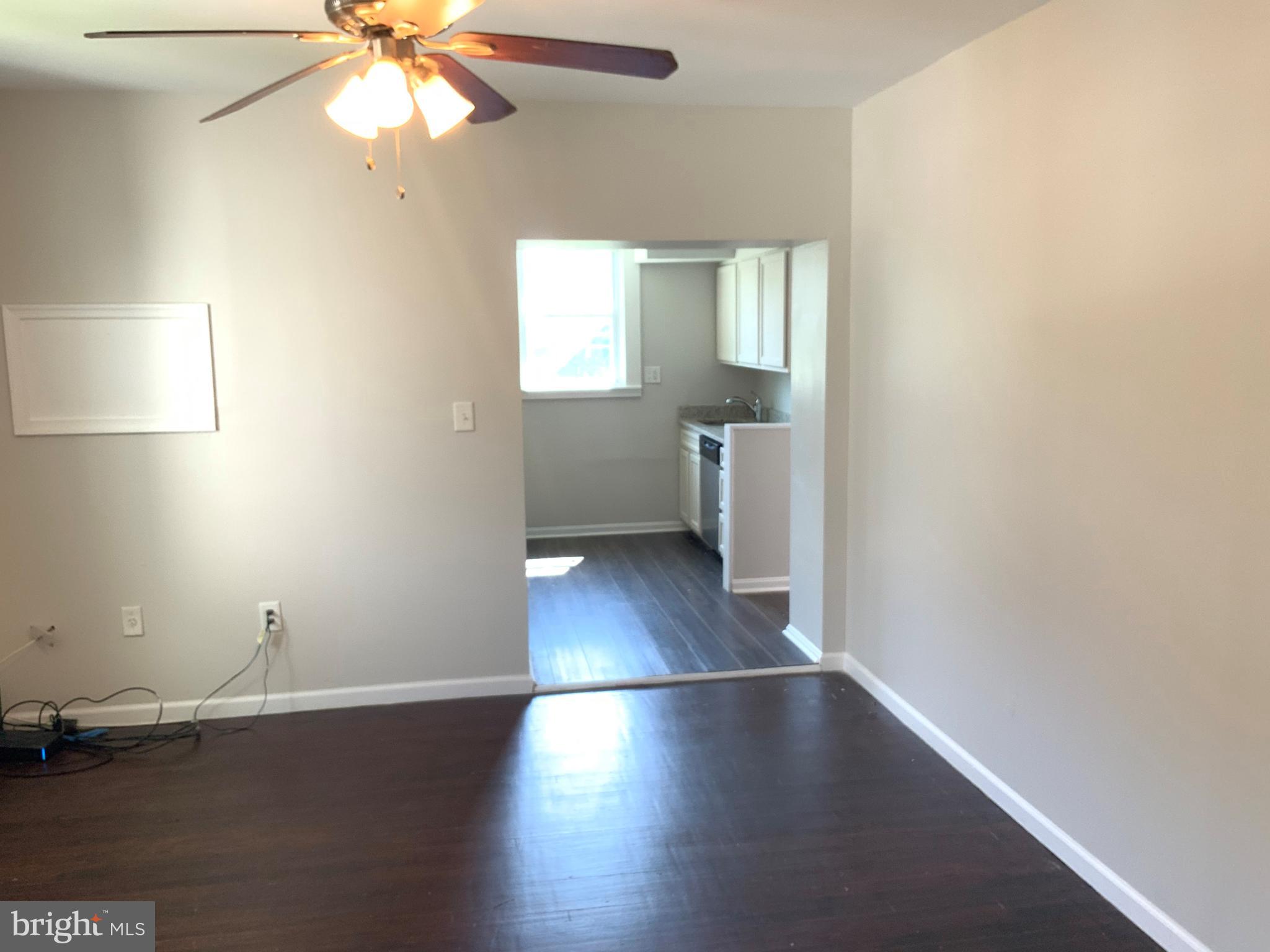 6209 York Road, Unit A Baltimore, MD 21212 - Photo 14 of 31 an empty room with wooden floor and windows