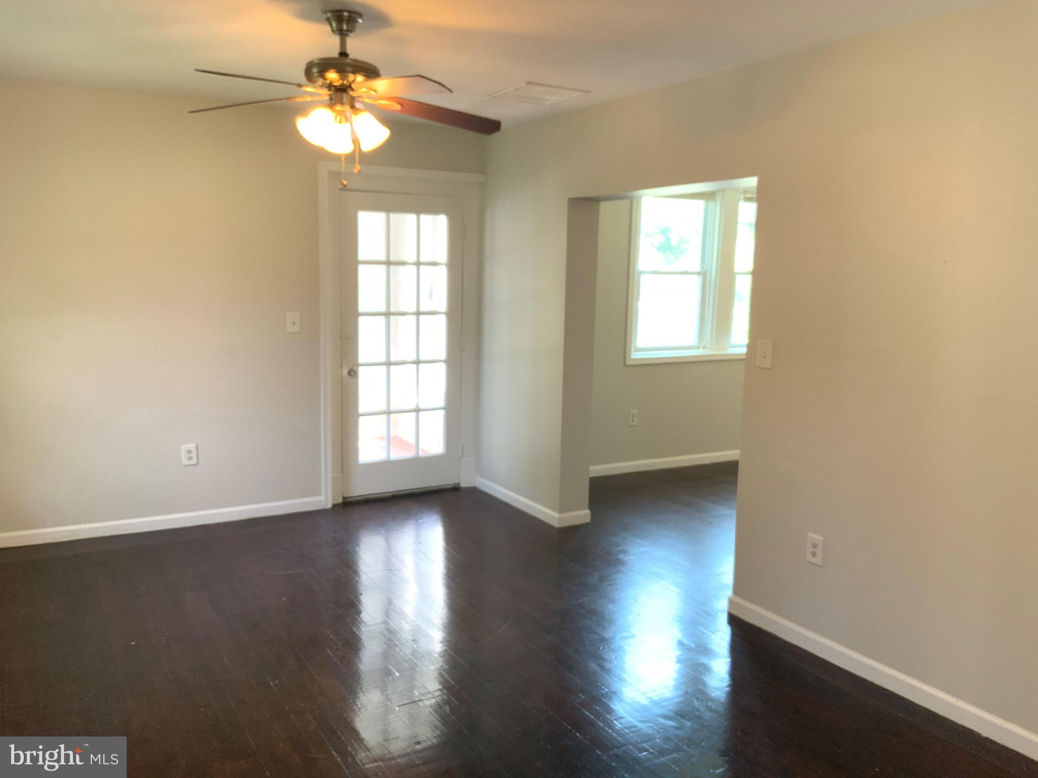 6209 York Road, Unit A Baltimore, MD 21212 - Photo 6 of 31 a view of empty room with wooden floor and fan