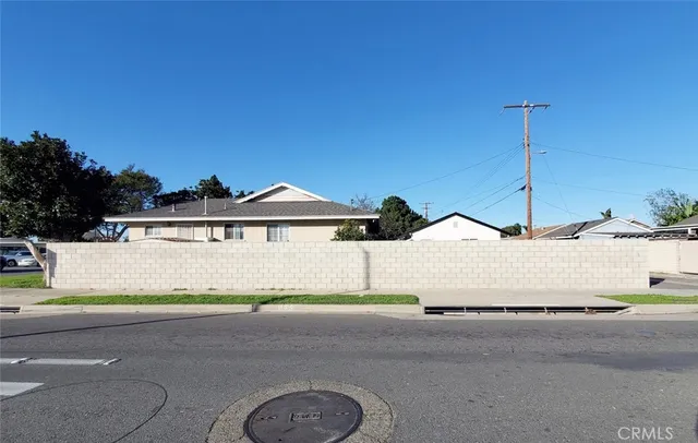 a view of house with yard and street view