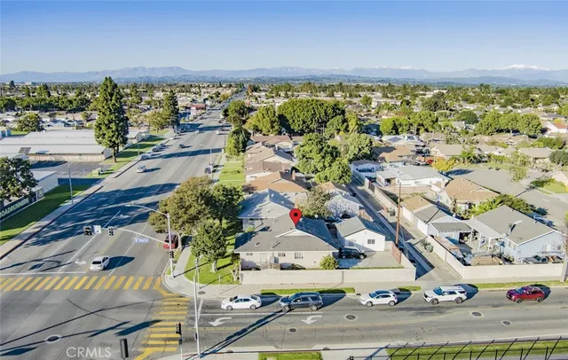 an aerial view of residential building and ocean