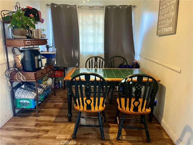 a view of a chairs and table in the balcony