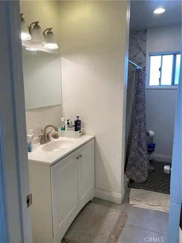 a bathroom with a sink a vanity and a mirror