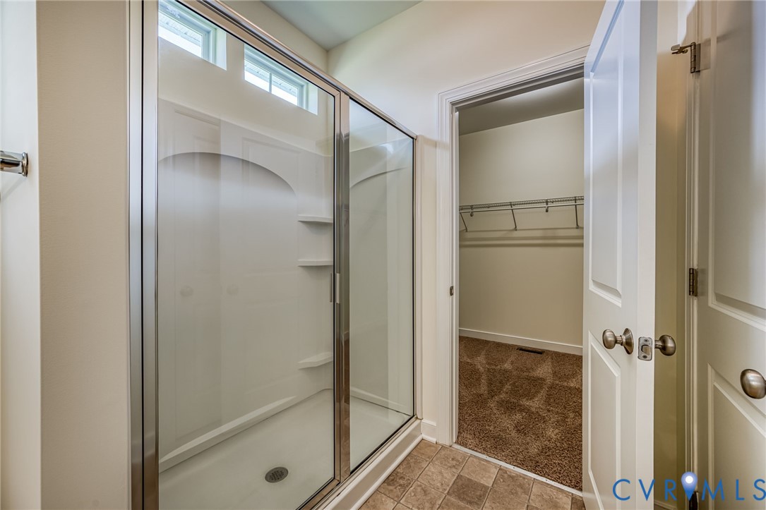 11224 Hill Ridge Court Ashland, VA 23005 - Photo 18 of 35 a bathroom with a glass shower door