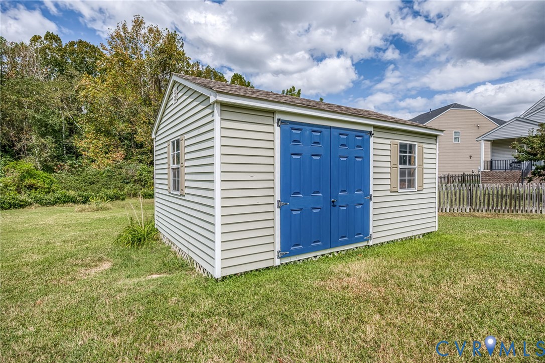 11224 Hill Ridge Court Ashland, VA 23005 - Photo 33 of 35 a view of a house with a backyard