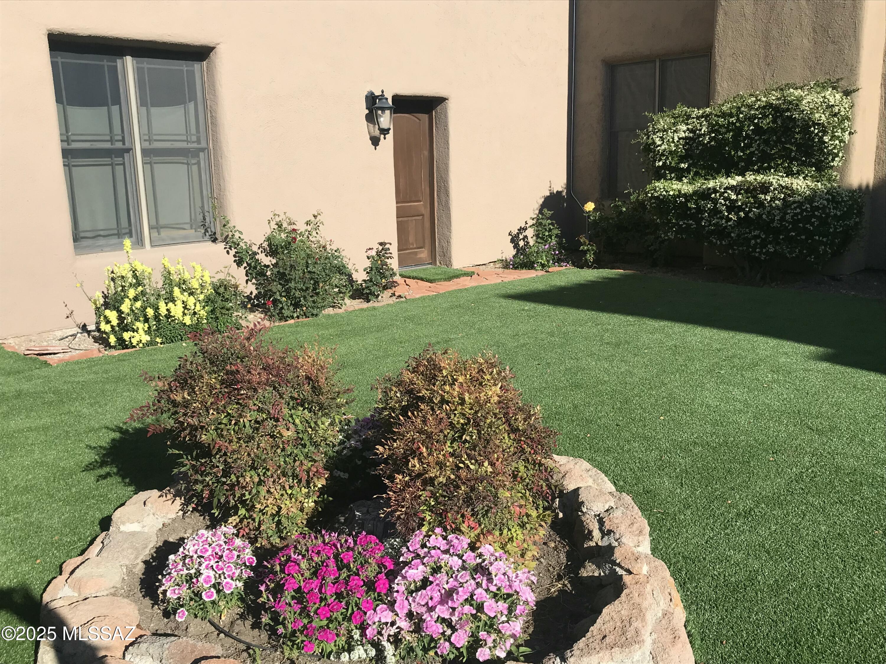 1265 Morning Star Drive Rio Rico, AZ 85648 - Photo 28 of 50 a view of a garden with a flower garden