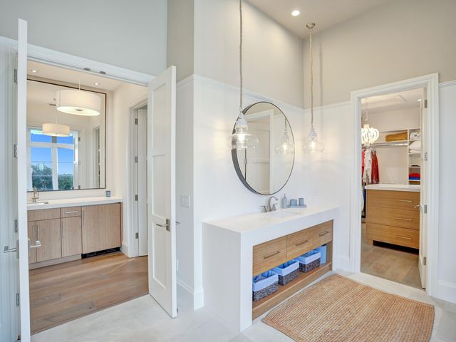a kitchen with a sink and a stove top oven