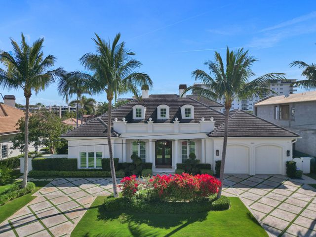 a front view of house and yard with swimming pool and green space