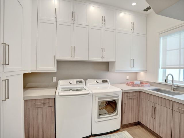 a living room with furniture fireplace and palm trees