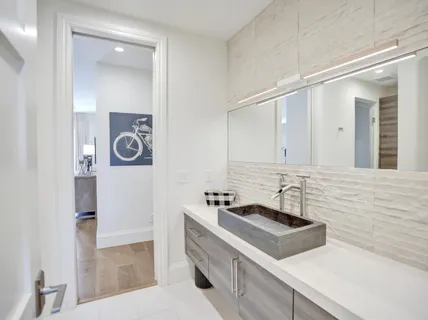 an aerial view of a city with ocean view