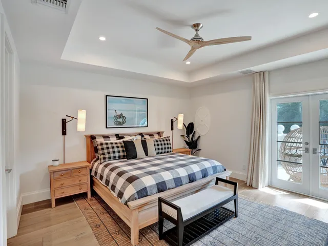 a view of a chairs and table in patio with a lake view