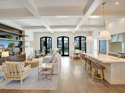 a kitchen with a stove a refrigerator and a fireplace