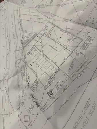 a dirty bathroom with white tiles