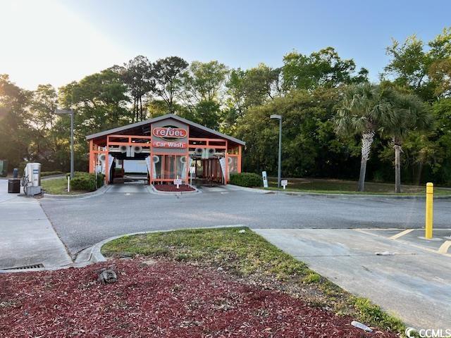 View of road with street lighting and driveway