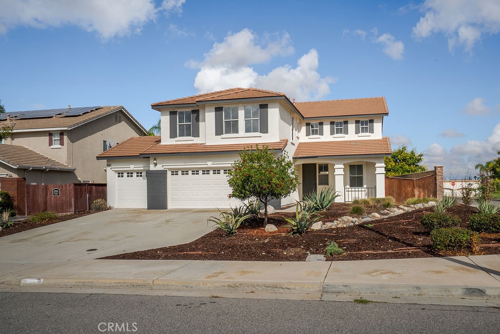 19068 Clover Court Riverside, CA 92508 - Photo 1 of 1 a front view of a house with a yard and garage